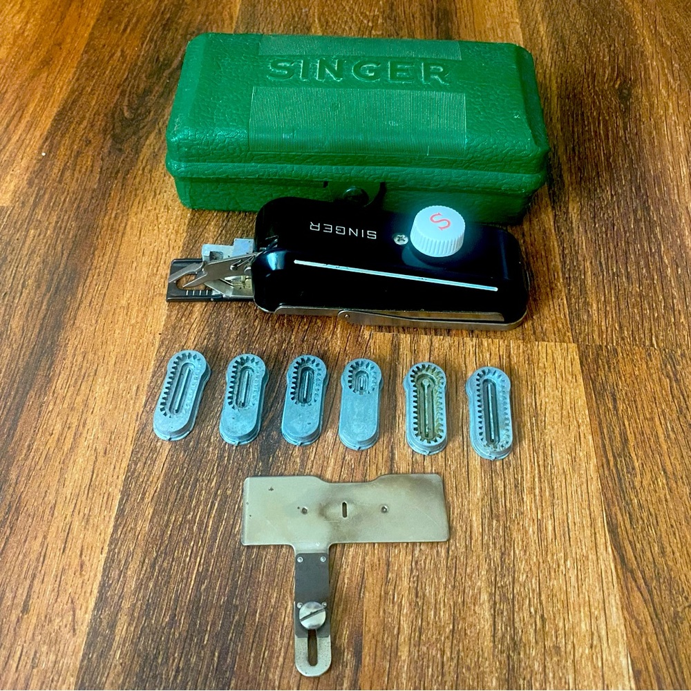 Vintage singer handheld sewing machine.